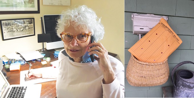 Christine Contillo sits at her desk with the phone to her ear smiling