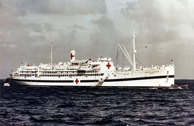 A picture of the white Relief ship that is on a dark blue ocean with a gray sky in the background