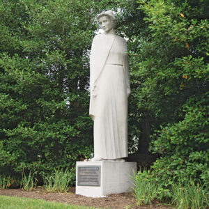 The Nurses Memorial, a granite statue of a nurse in uniform, is located in Section 21 in Arlington National Cemetery, June 15, 2015, in Arlington, Va. The memorial was originally erected in 1938 and rededicated in 1971. (U.S. Army photo by Rachel Larue/released)
